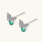 Anointed Garments butterfly stud earrings in platinum-plated sterling silver with green moissanite and clear accents.