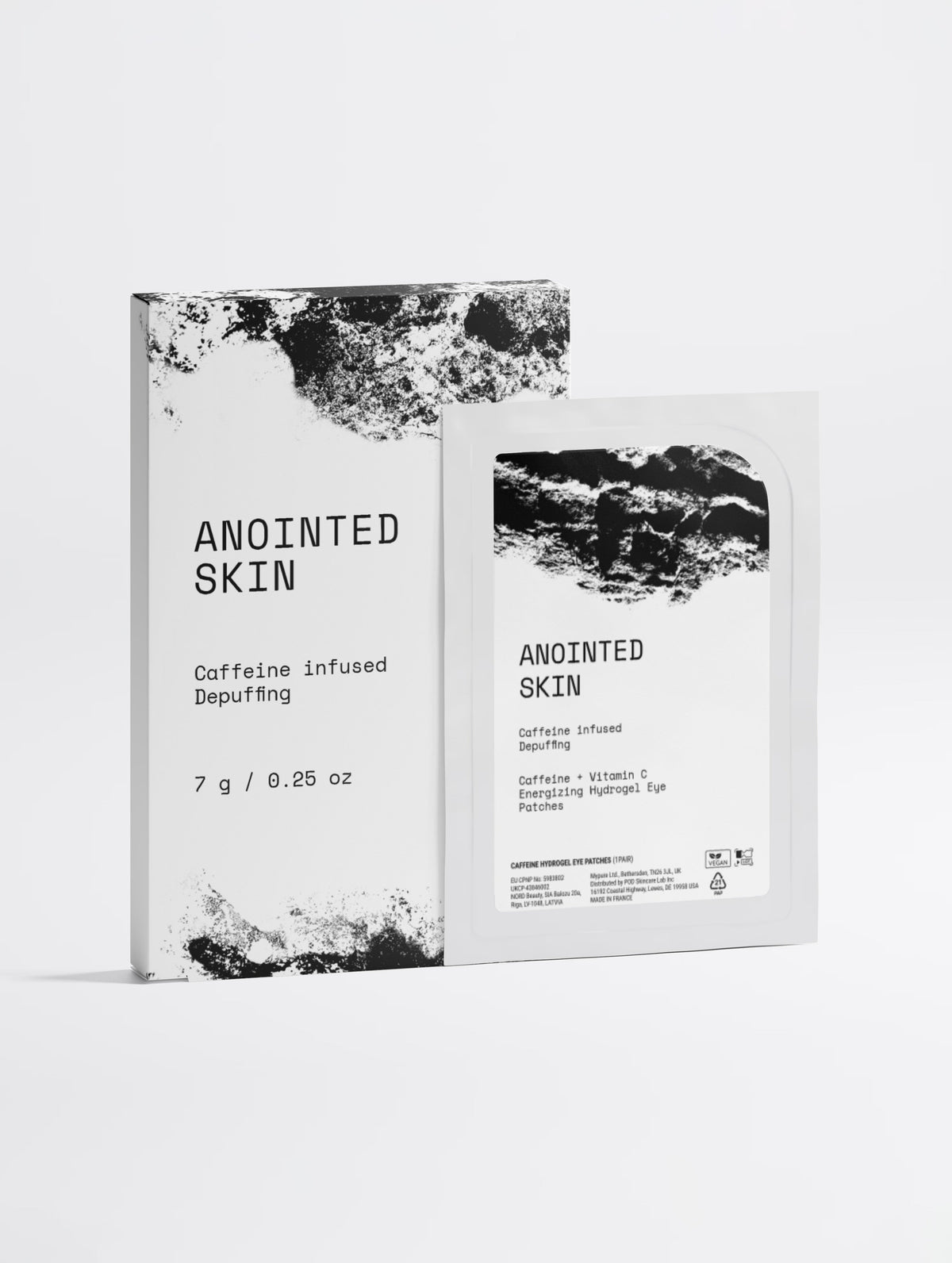 Anointed Garments Anointed Skin caffeine and vitamin C hydrogel eye patch box and single-use sachet in white packaging.