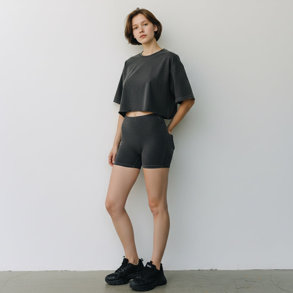Model wearing Anointed Garments charcoal grey heavyweight cotton cropped boxy t-shirt with matching shorts and sneakers