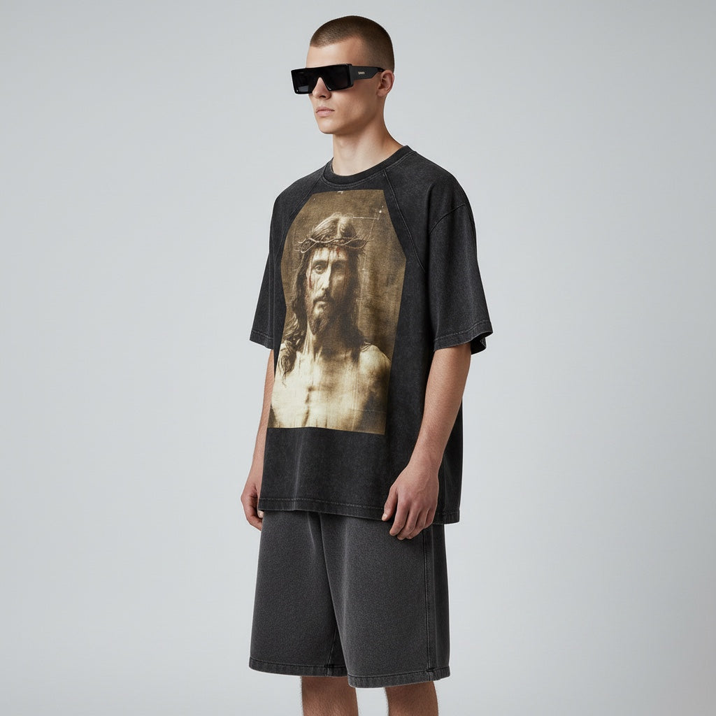 Model wearing Anointed Garments charcoal black vintage-wash cotton graphic t-shirt with raglan sleeves and matching shorts