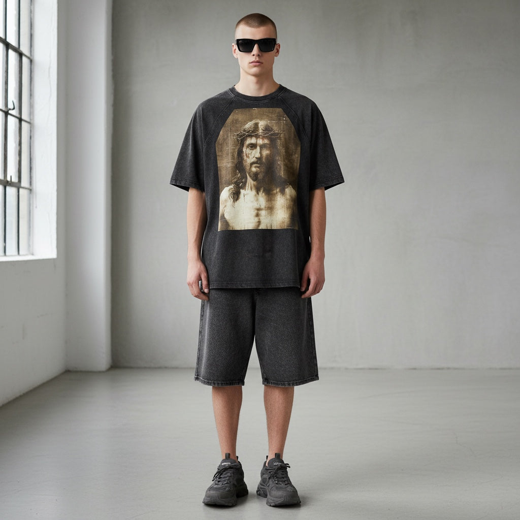 Anointed Garments charcoal black cotton graphic t-shirt with raglan sleeves and vintage wash worn by a male model.