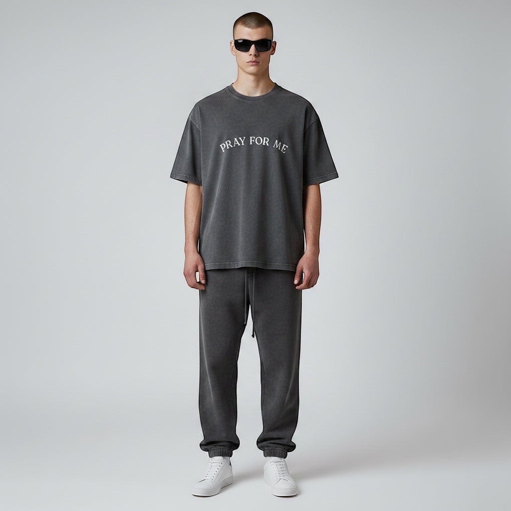Anointed Garments Pray For Me graphic t-shirt in charcoal mineral-wash cotton worn by a model with sunglasses