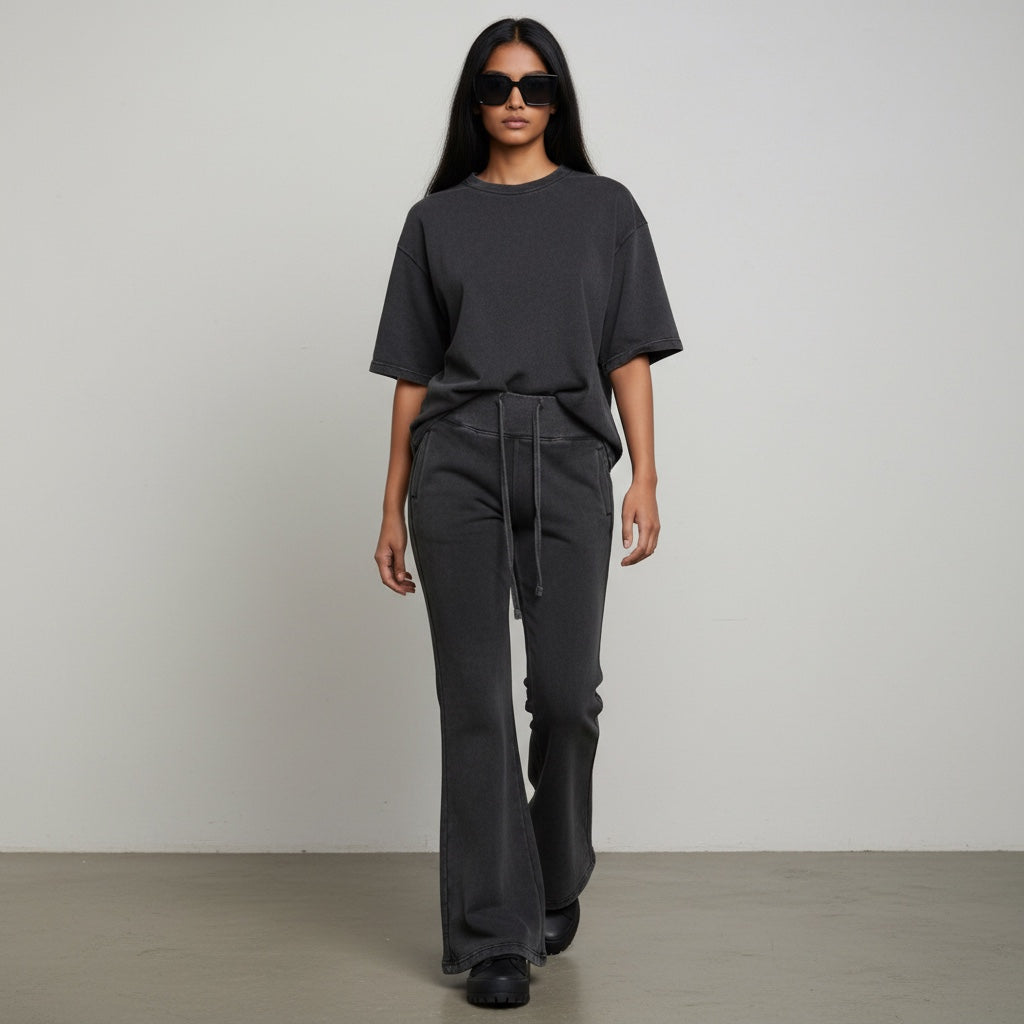 Anointed Garments high-waisted wide-leg lounge pants in a charcoal vintage wash with a drawstring waist and side pockets.
