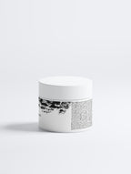 Anointed Garments clay mask jar with white lid and black and white label for pore and blackhead treatment