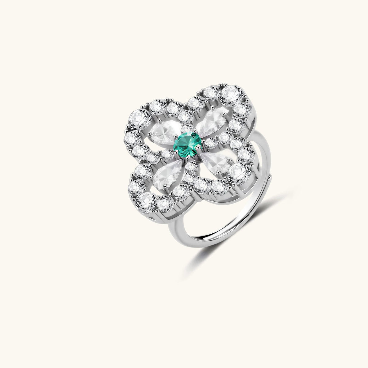 Anointed Garments platinum-plated sterling silver four-leaf clover ring with a central green stone and moissanite.