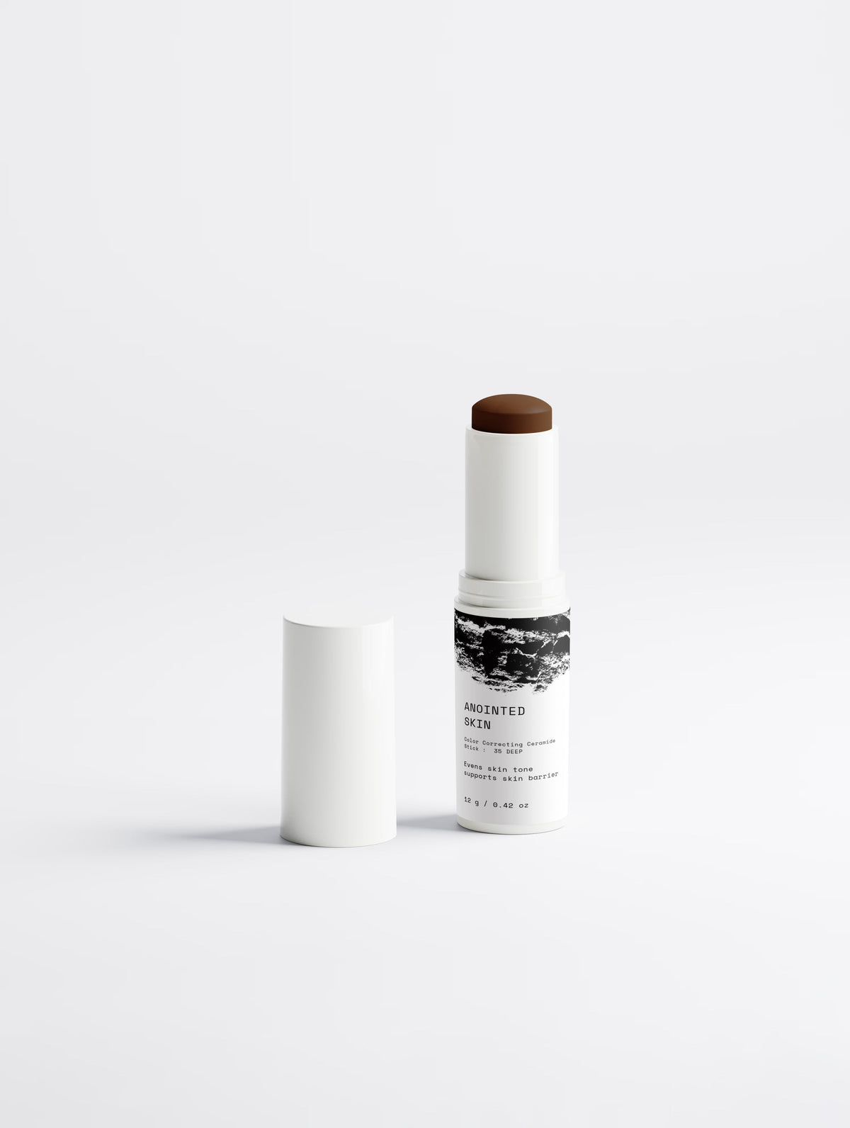 Anointed Garments Anointed Skin color-correcting ceramide stick in shade 35 Deep with a creamy dark brown formula.