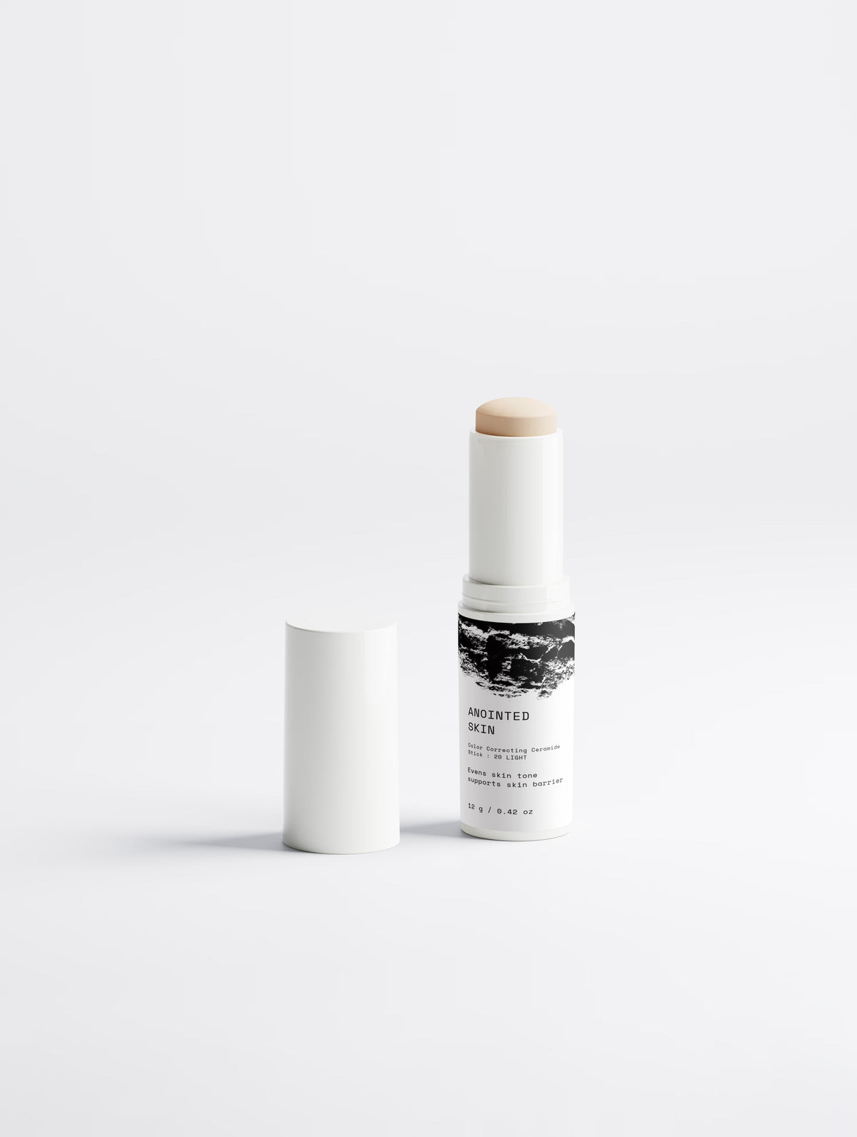 Anointed Garments Anointed Skin Color-Correcting Ceramide Stick in shade 20 Light with its white cap removed.