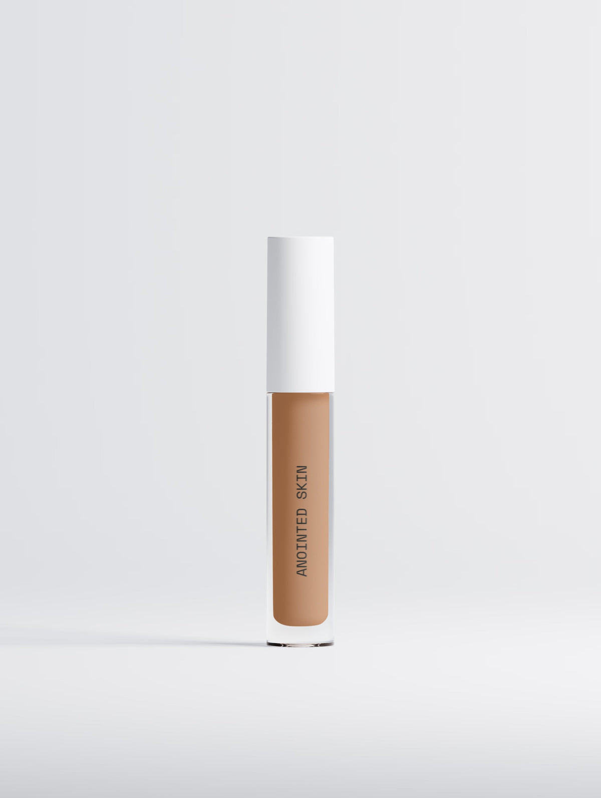 Anointed Garments Anointed Skin Correcting Concealer in 25 Medium Neutral with a white cap and clear tube