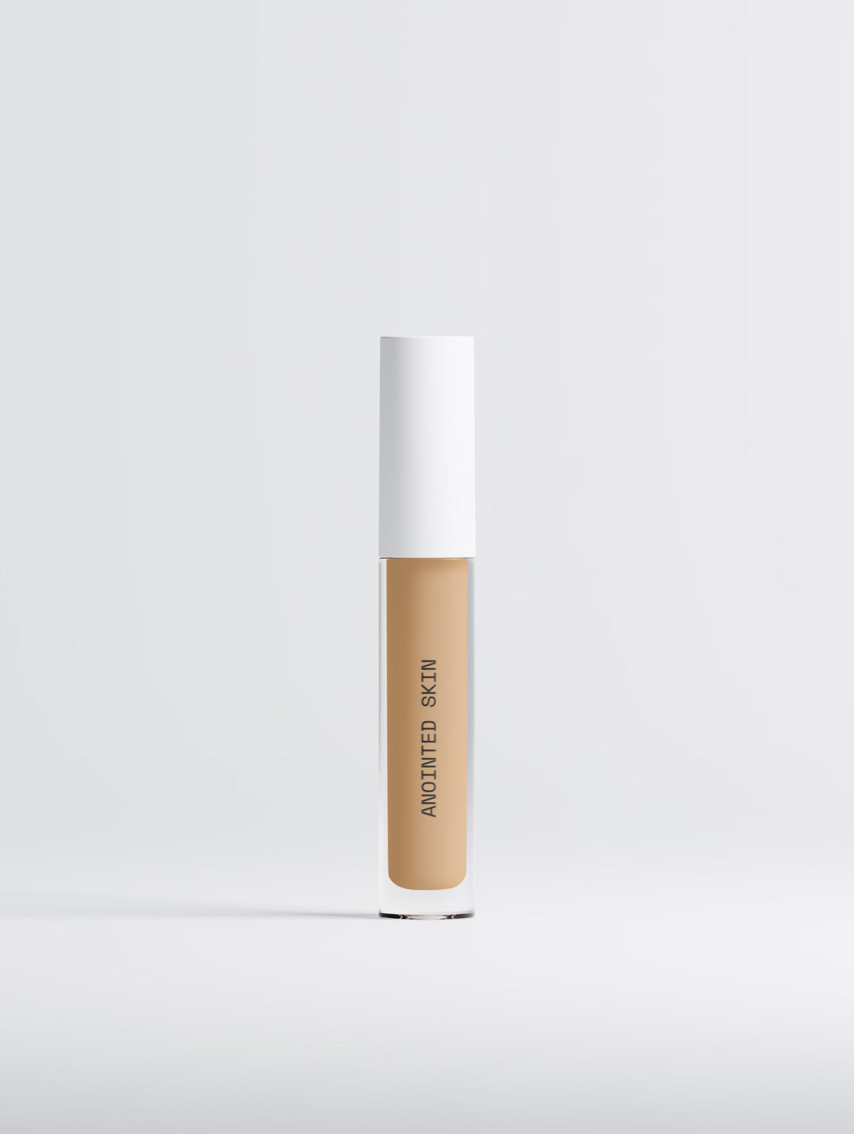 Anointed Garments Anointed Skin Correcting Concealer in 20 Medium Warm with a white cap and clear tube.