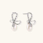 Anointed Garments Crystal Bow Pearl Drop earrings in rhodium-plated sterling silver with baguette-cut crystal accents.