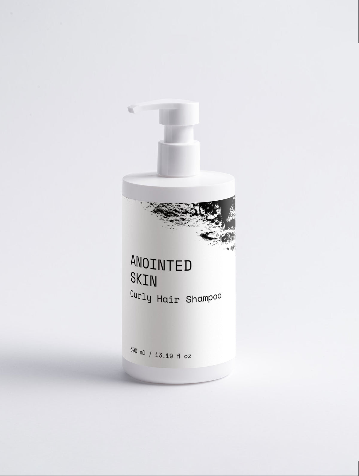 Anointed Garments Anointed Skin Curly Hair Shampoo in a white bottle with a pump dispenser on a light background.