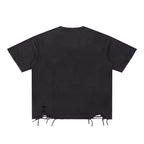Anointed Garments washed black cotton crewneck t-shirt with distressed hem detailing and a loose, modern fit.