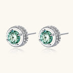 Anointed Garments emerald green round-cut moissanite halo stud earrings in platinum-plated 925 sterling silver.