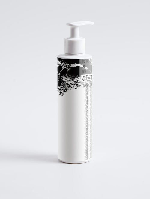Anointed Garments ANOINTED SKIN Gentle Cleansing Milk in a white pump bottle with black abstract graphic design.