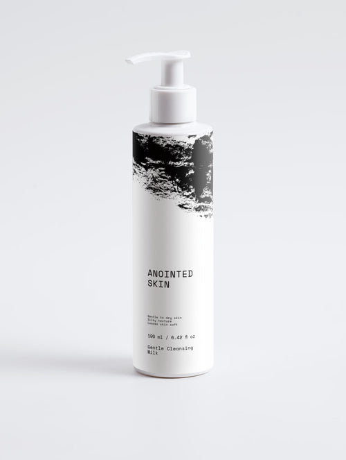 Anointed Garments ANOINTED SKIN Gentle Cleansing Milk in a white pump bottle with black abstract graphic design.