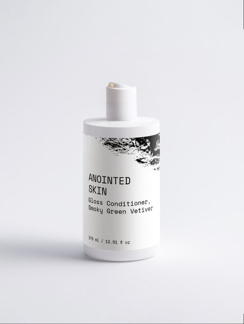Anointed Garments ANOINTED SKIN Gloss Conditioner in a white bottle with minimalist black typography and label design.