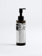 Anointed Garments Anointed Skin Omega 6-9 Glowing Skin Body Oil in a dark amber bottle with a black pump dispenser.