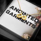 Anointed Garments 18k yellow gold heart infinity necklace on a delicate cable chain in a gift box.