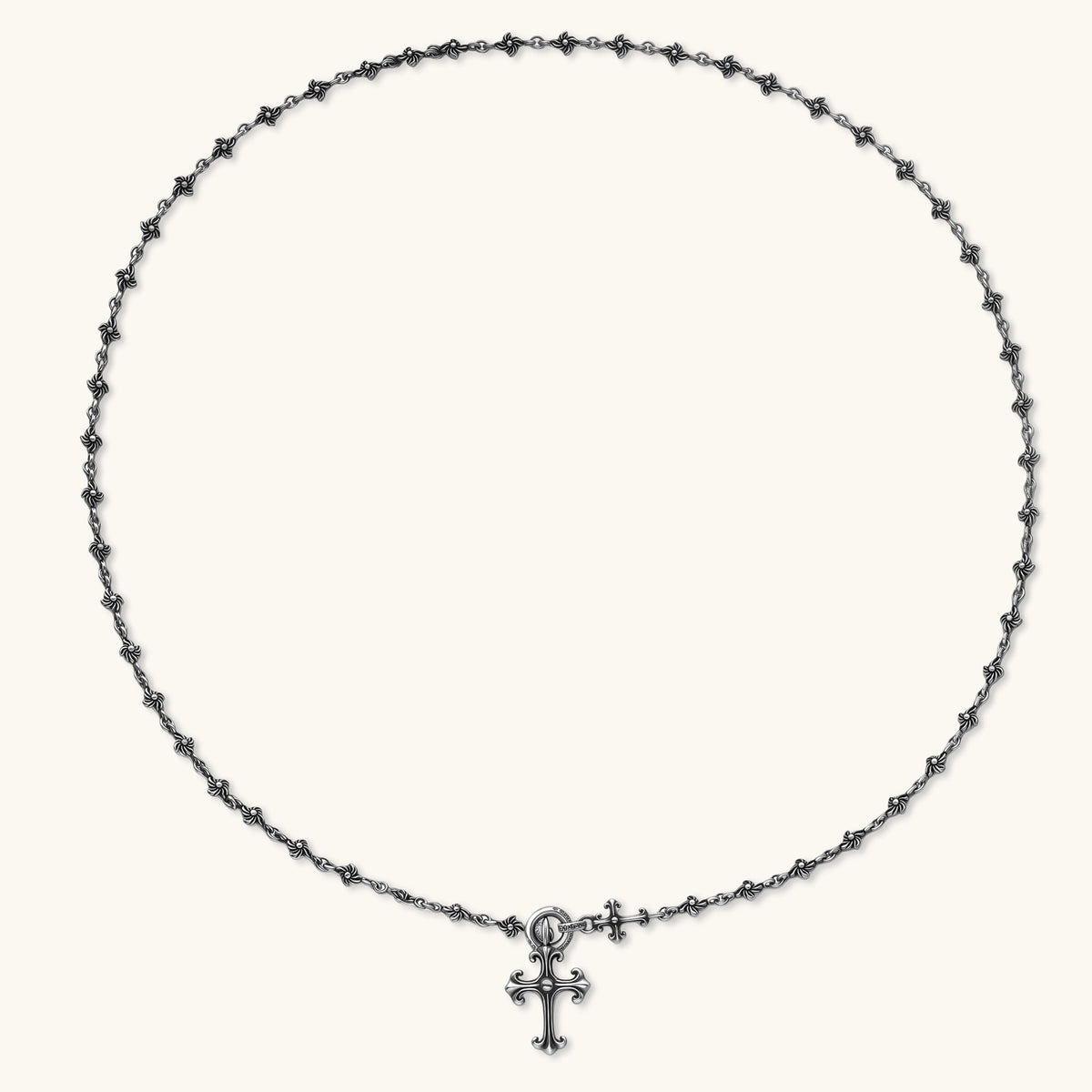 Anointed Garments sterling silver gothic cross necklace with an ornate fleur-de-lis pendant and oxidized floral chain.