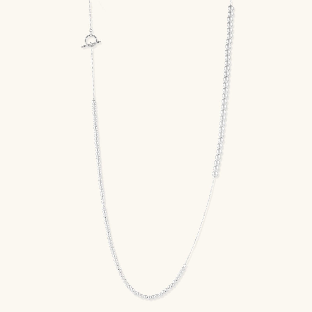 Anointed Garments long sterling silver necklace with graduated polished spheres and a toggle clasp closure.