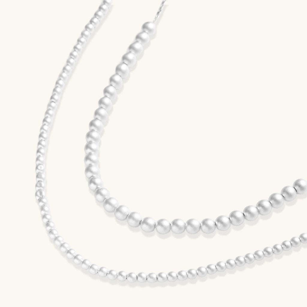 Anointed Garments graduated sterling silver sphere necklace with polished beads ranging from 3.9mm to 6.0mm in size.
