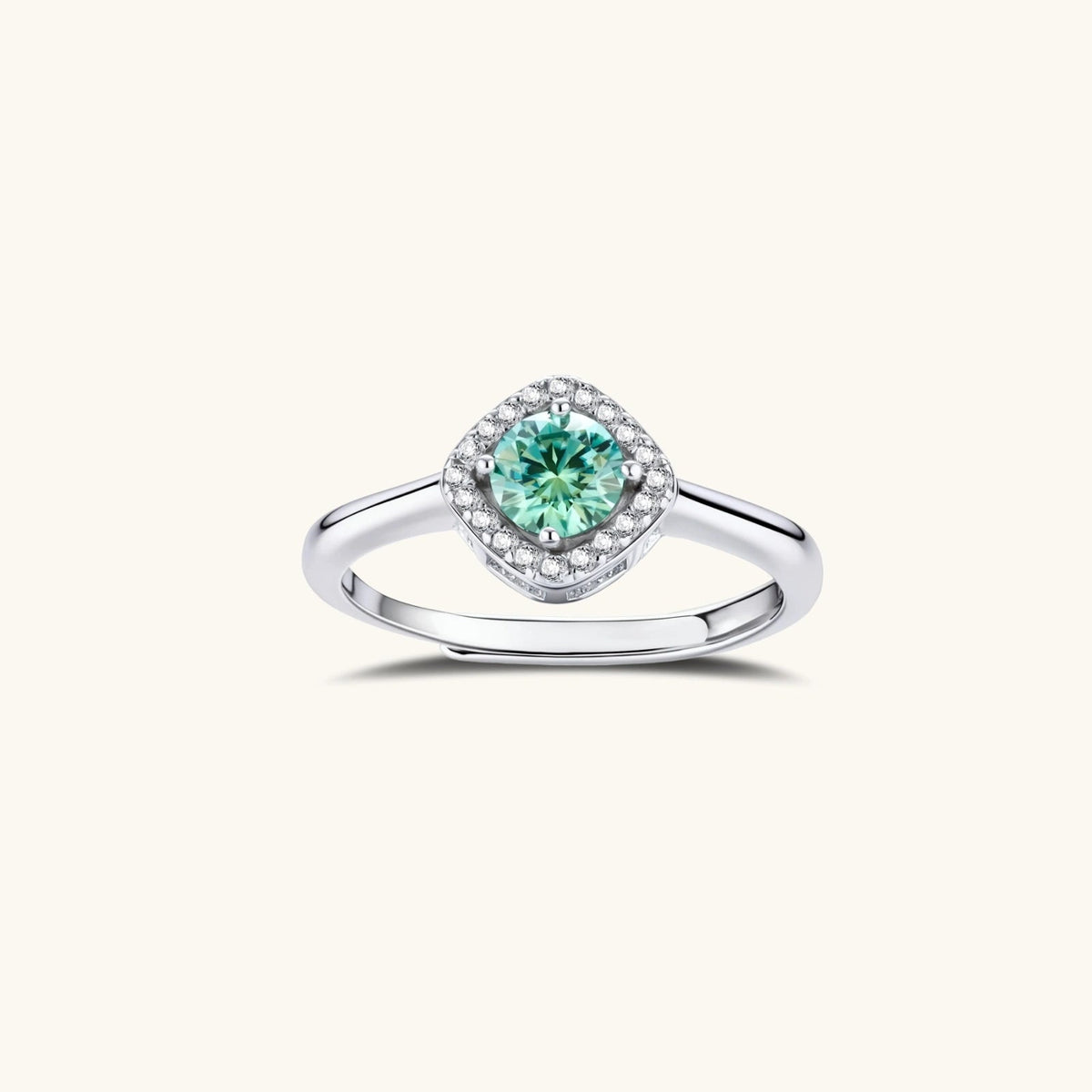 Anointed Garments emerald green round-cut moissanite halo ring in platinum-plated sterling silver with adjustable band.