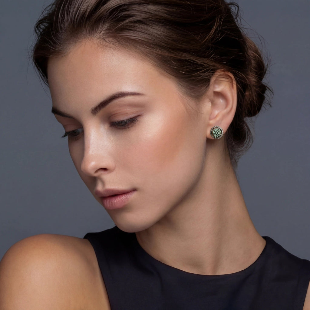 Anointed Garments Emerald Spark Halo Studs featuring round green moissanite in platinum-plated sterling silver on a model
