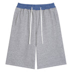 Anointed Garments unisex grey cotton-blend shorts featuring a blue plaid elastic waistband and white drawstring.