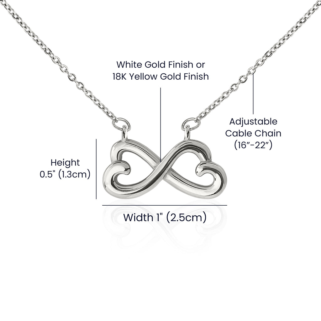 Anointed Garments heart infinity necklace with white gold finish, adjustable cable chain, and product dimensions.