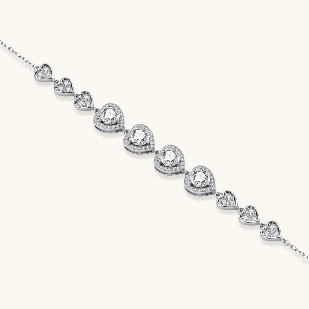 Anointed Garments heart-shaped moissanite bracelet in platinum-plated sterling silver with delicate link chain.