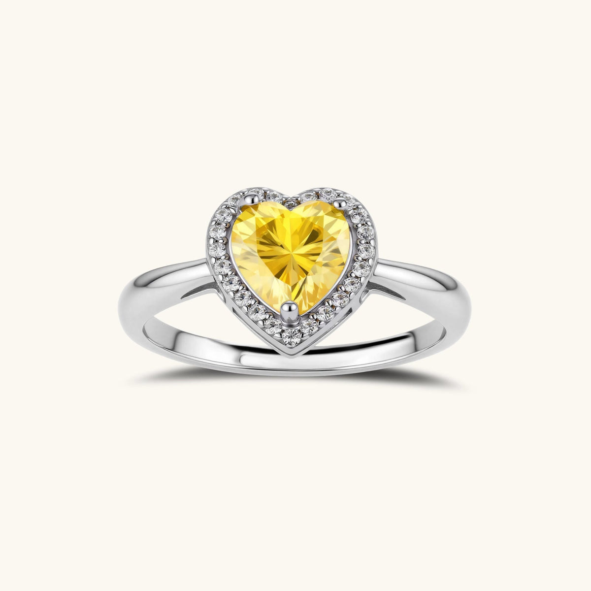 Anointed Garments heart-shaped yellow moissanite halo ring with a polished platinum-plated sterling silver band.