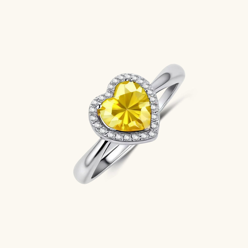 Anointed Garments heart-shaped yellow moissanite halo ring in platinum-plated sterling silver with an adjustable band.