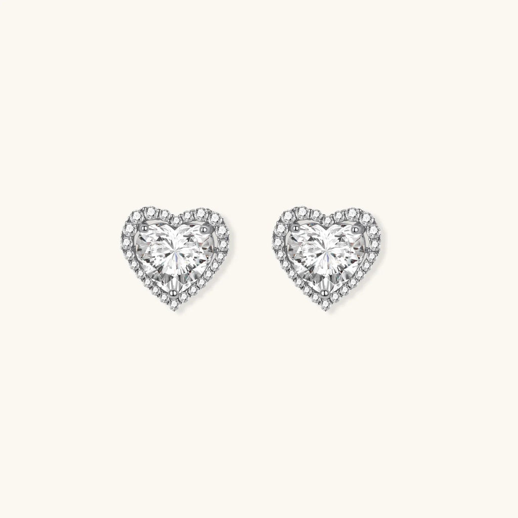 Anointed Garments heart-shaped moissanite stud earrings in platinum-plated sterling silver with round-cut stones.