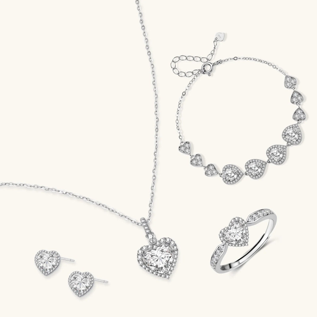 Anointed Garments Heart Symphony moissanite jewelry set featuring a necklace, earrings, ring, and bracelet in silver.