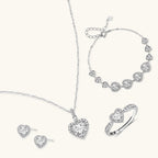 Anointed Garments Heart Symphony moissanite jewelry set featuring a necklace, earrings, ring, and bracelet in silver.