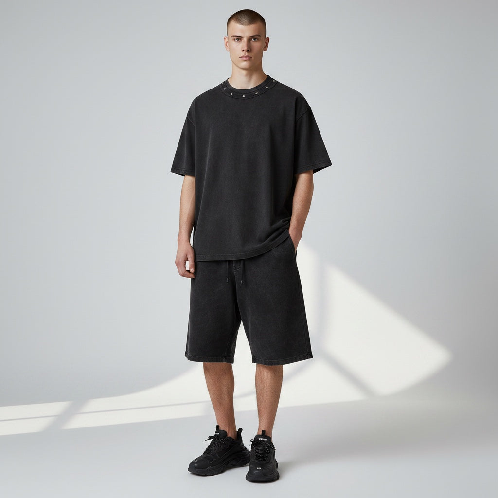 Model wearing Anointed Garments heavyweight black cotton crewneck t-shirt with metallic stud neckline and relaxed fit