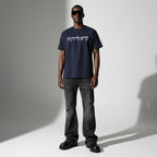 Model wearing Anointed Garments charcoal gray cotton t-shirt with white Hebrew script graphic and black sunglasses