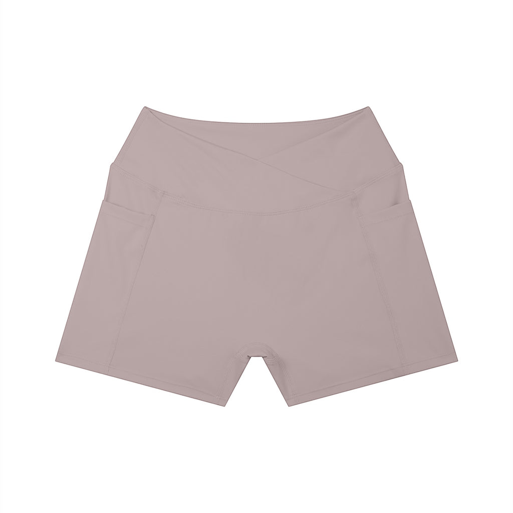 Anointed Garments high-rise yoga shorts in a soft mauve tone, featuring a crossover waistband and side pockets.