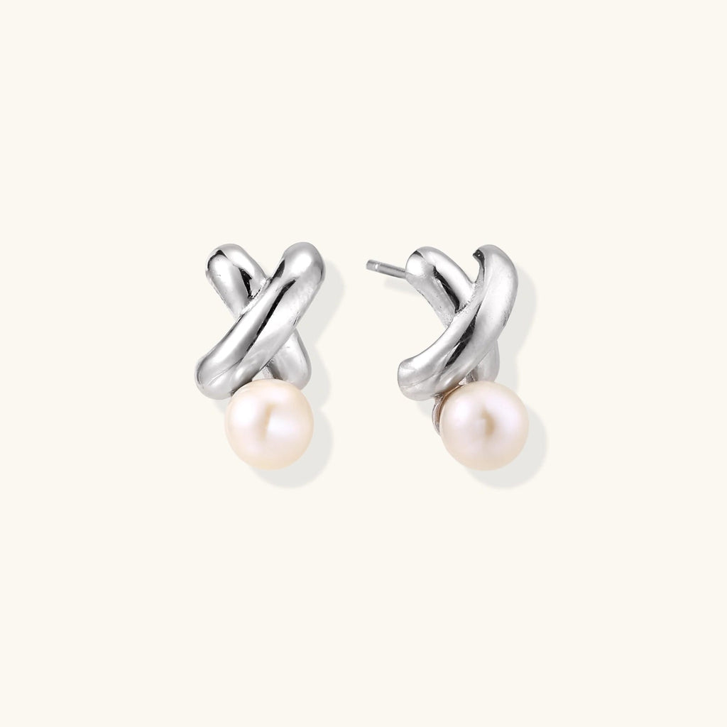 Anointed Garments Infinity Pearl Studs featuring sculptural rhodium-plated sterling silver twists and freshwater pearls.