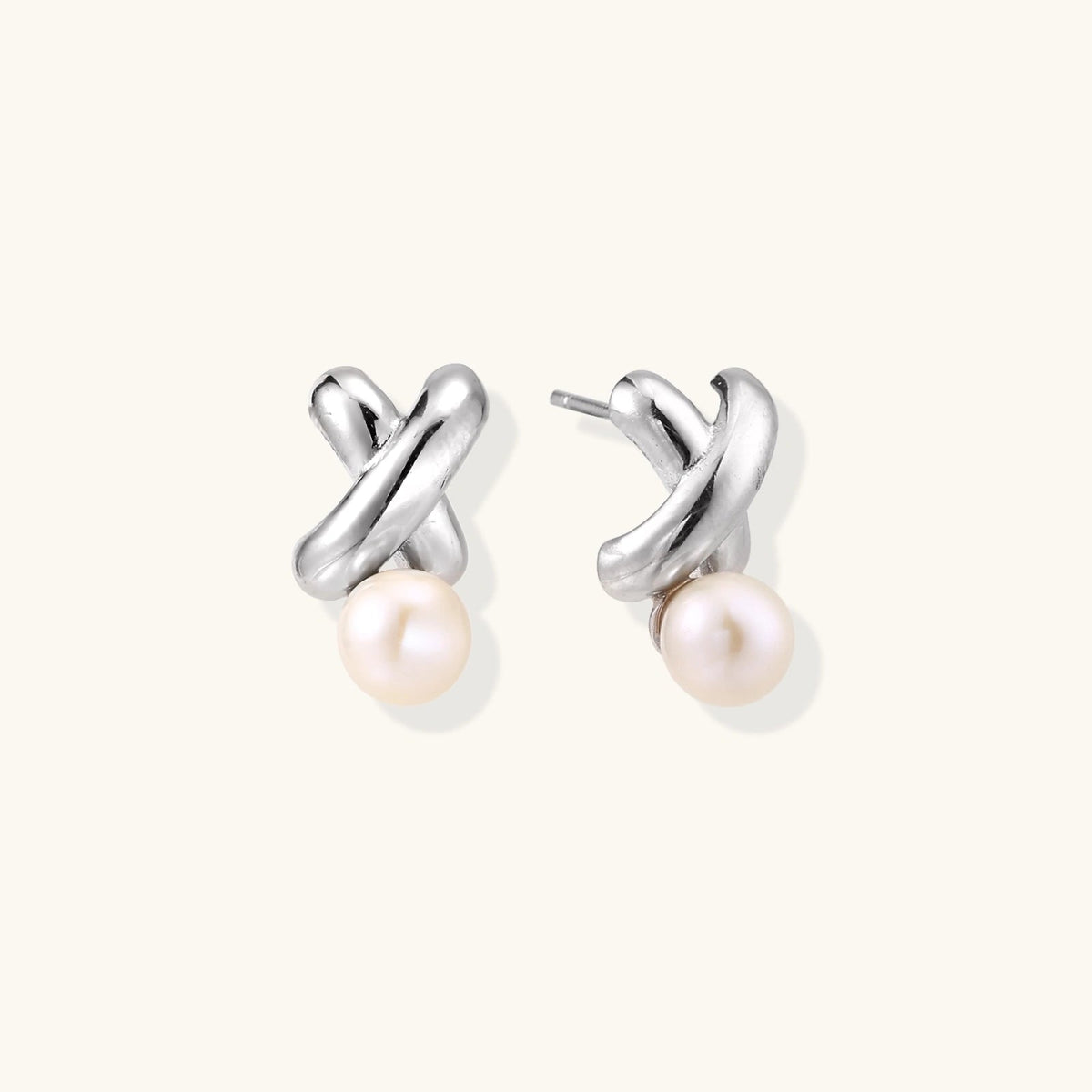 Anointed Garments Infinity Pearl Studs featuring sculptural rhodium-plated sterling silver twists and freshwater pearls.