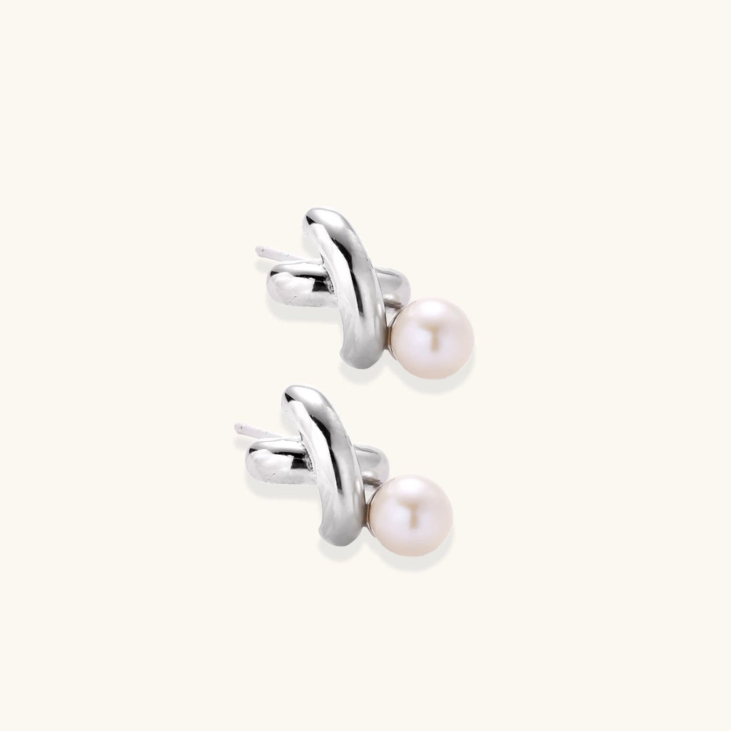 Anointed Garments Infinity Pearl Studs featuring sculptural rhodium-plated sterling silver twists and freshwater pearls.