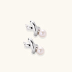 Anointed Garments Infinity Pearl Studs featuring sculptural rhodium-plated sterling silver twists and freshwater pearls.