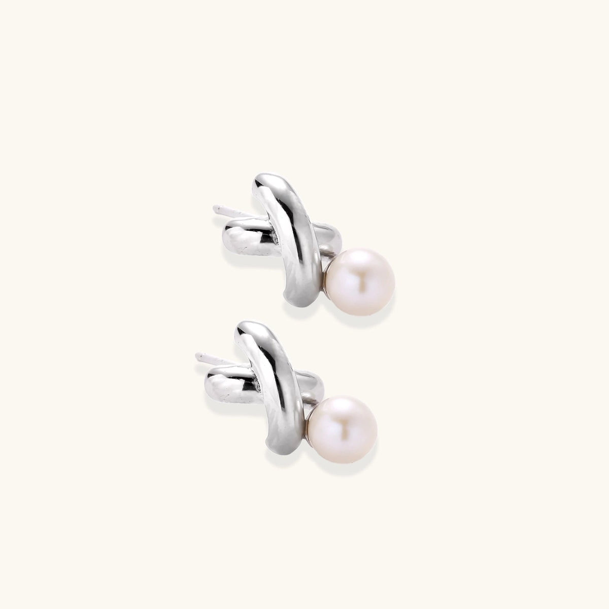 Anointed Garments Infinity Pearl Studs featuring sculptural rhodium-plated sterling silver twists and freshwater pearls.