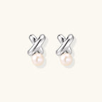 Anointed Garments Infinity Pearl Studs featuring sculptural rhodium-plated sterling silver twists and freshwater pearls.