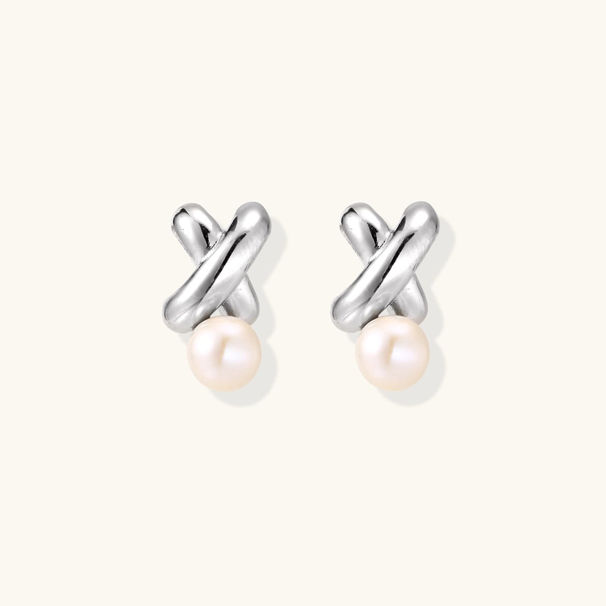 Anointed Garments Infinity Pearl Studs featuring sculptural rhodium-plated sterling silver twists and freshwater pearls.