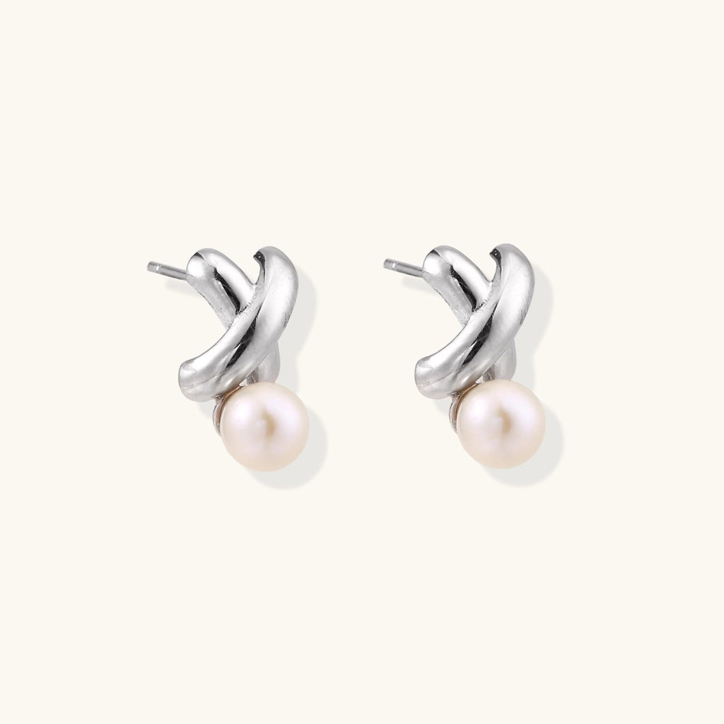 Anointed Garments Infinity Pearl Studs featuring sculptural rhodium-plated sterling silver twists and freshwater pearls.