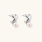 Anointed Garments Infinity Pearl Studs featuring sculptural rhodium-plated sterling silver twists and freshwater pearls.