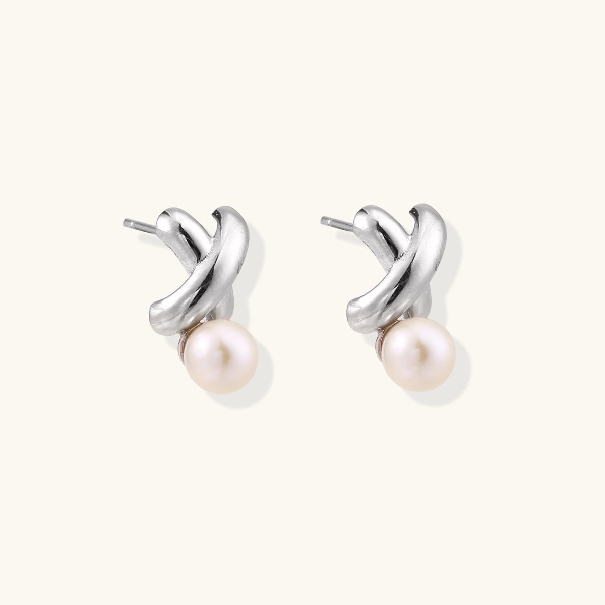 Anointed Garments Infinity Pearl Studs featuring sculptural rhodium-plated sterling silver twists and freshwater pearls.