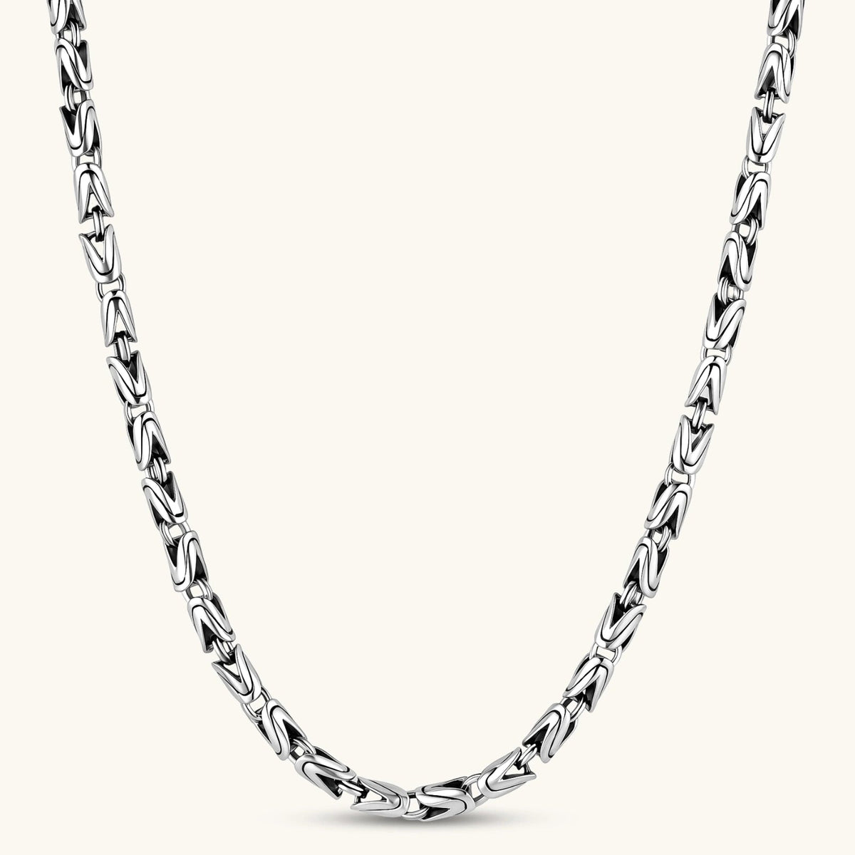 Anointed Garments King Byzantine necklace featuring thick interlocking antique silver-plated links in a woven pattern.
