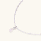 Anointed Garments Lavender Dreams pearl necklace with lavender crystal beads, geometric pendant, and freshwater pearl.